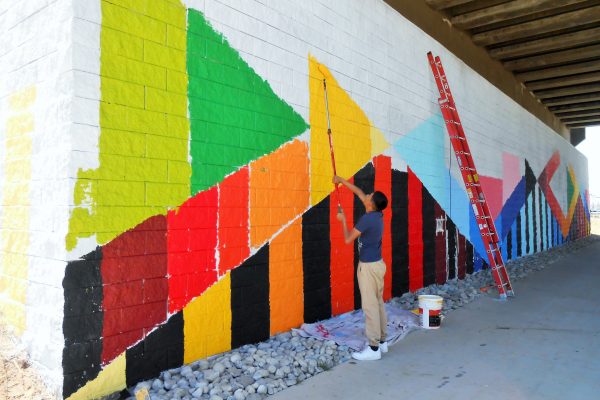 Birdseed Collective recruited local youth to help paint the art installation. | Photo courtesy, Alana Romans
