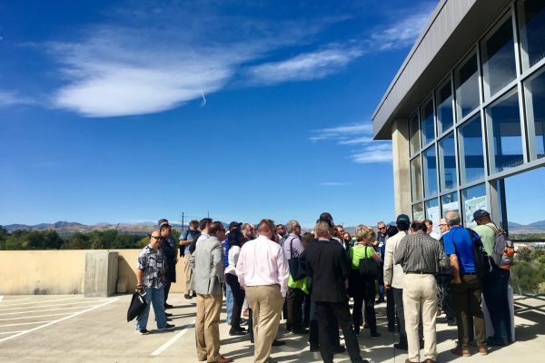 ULC's tour included over 35 participants from across the U.S. and Canada. Here, George Thorn of Mile High Development and Carl Koelbel of  Koelbel and Company speak to guests at Sheridan Station.
