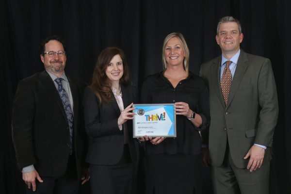 Urban Land Conservancy and FirstBank accept the 2019 Metro Vision Award from the Denver Regional Council of Governments (DRCOG) for the Metro Denver Impact Facility (MDIF). From left: Aaron Miripol, Amber Hills, Christi Smith and Stu Wright.
