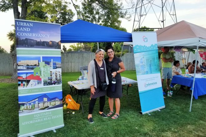 Carmen Atilano of Urban Land Conservancy and Jessica Dominguez of Interfaith Alliance pose for a photo at Westwood's National Night Out event.