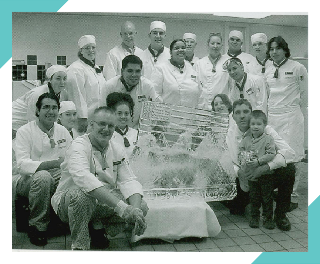 JWU students pose by their ice carving in 2002