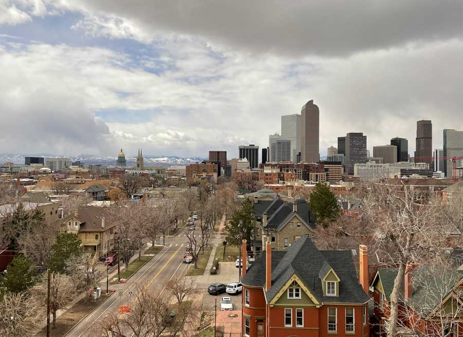 A view of Downtown Denver and the Rocky Mountains from Urban Land Conservancy's Mountainview Nonprofit Tower
