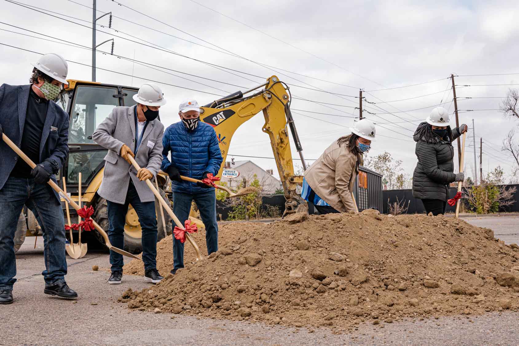 Staff at Urban Land Conservancy breaking ground on an affordable housing development near Denver's RiNo district  